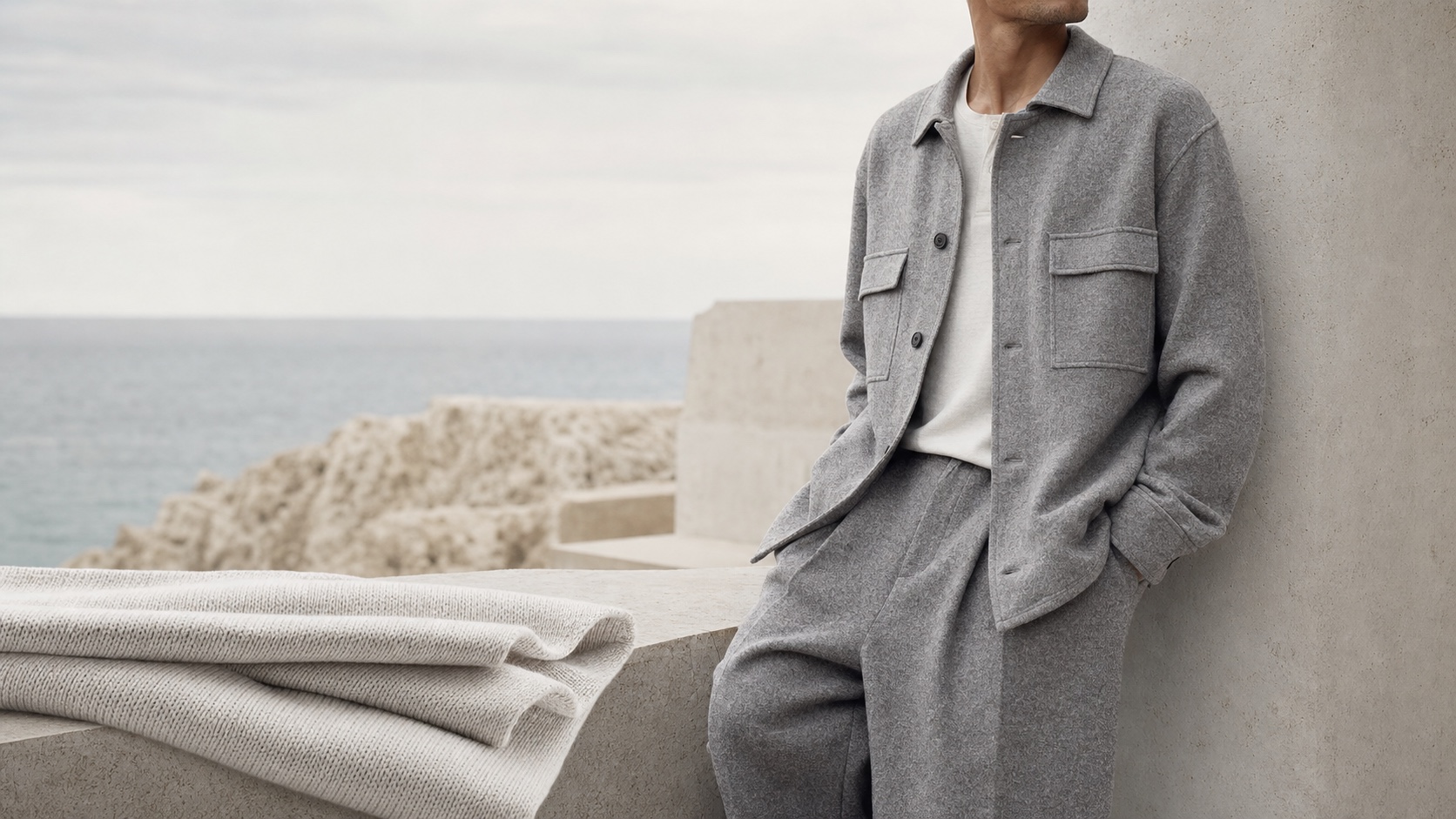 Stone-grey knitted fabrics in a quiet menswear setting