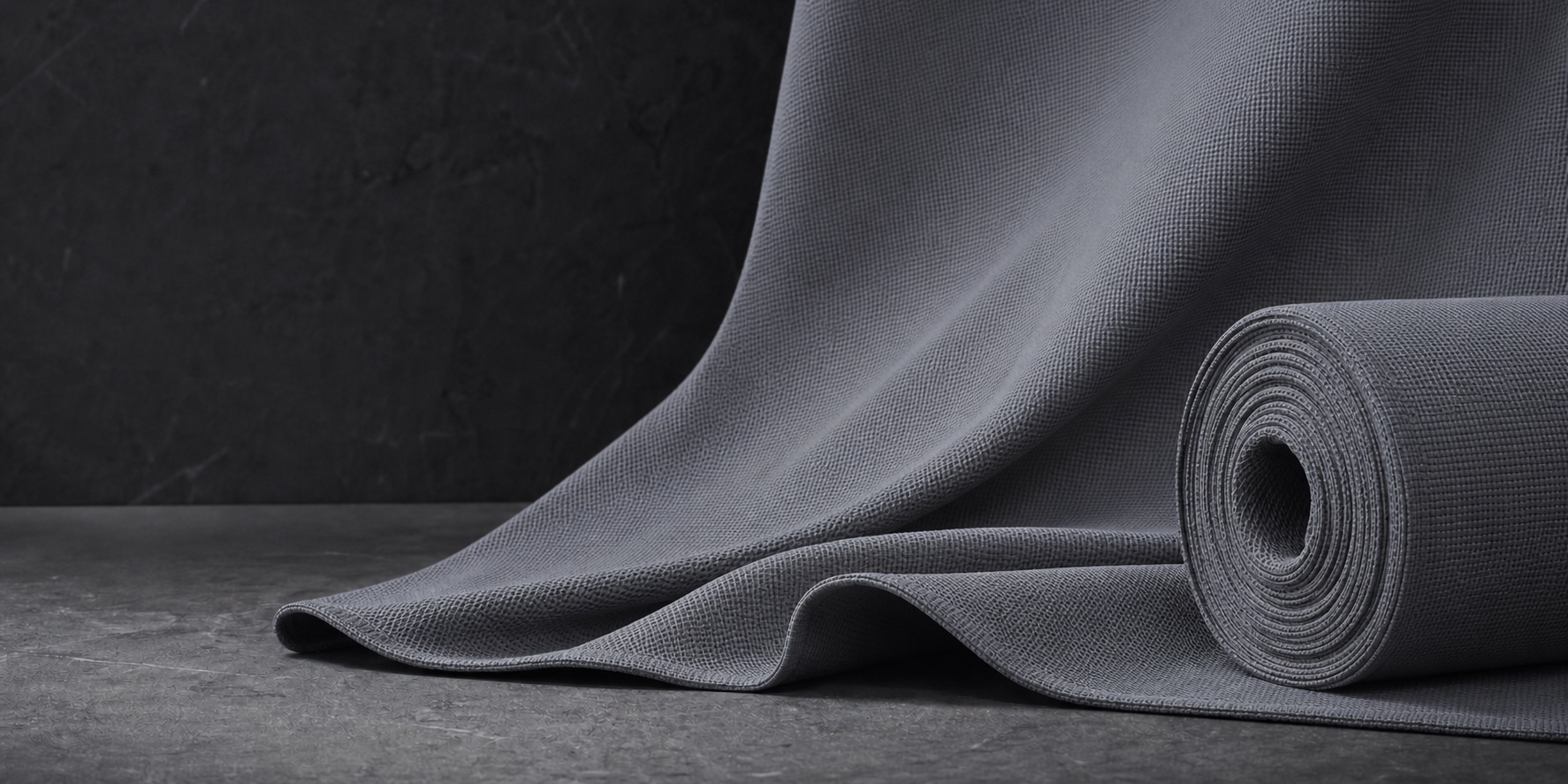 Graphite performance knit fabric arranged in sculptural folds